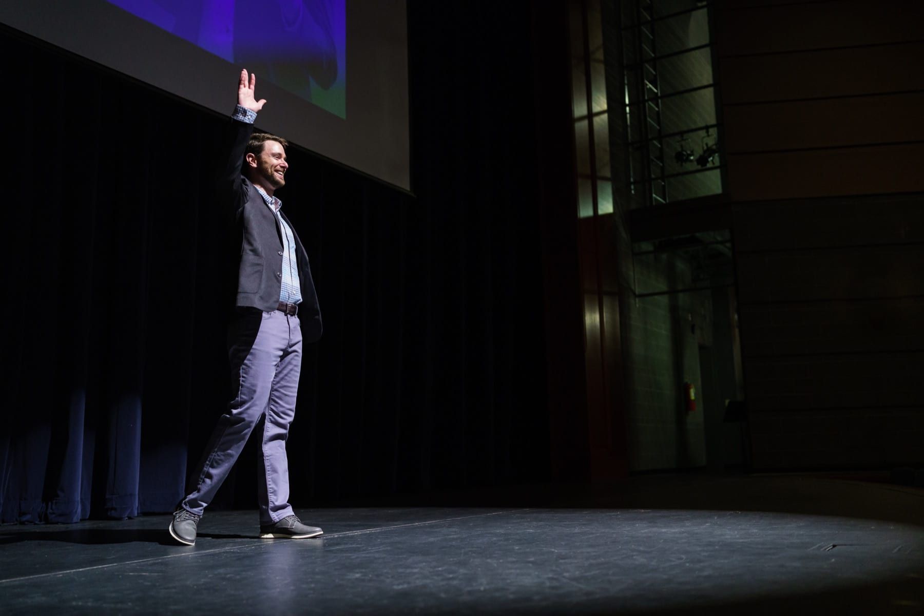 Peter Lazaroff speaking on stage